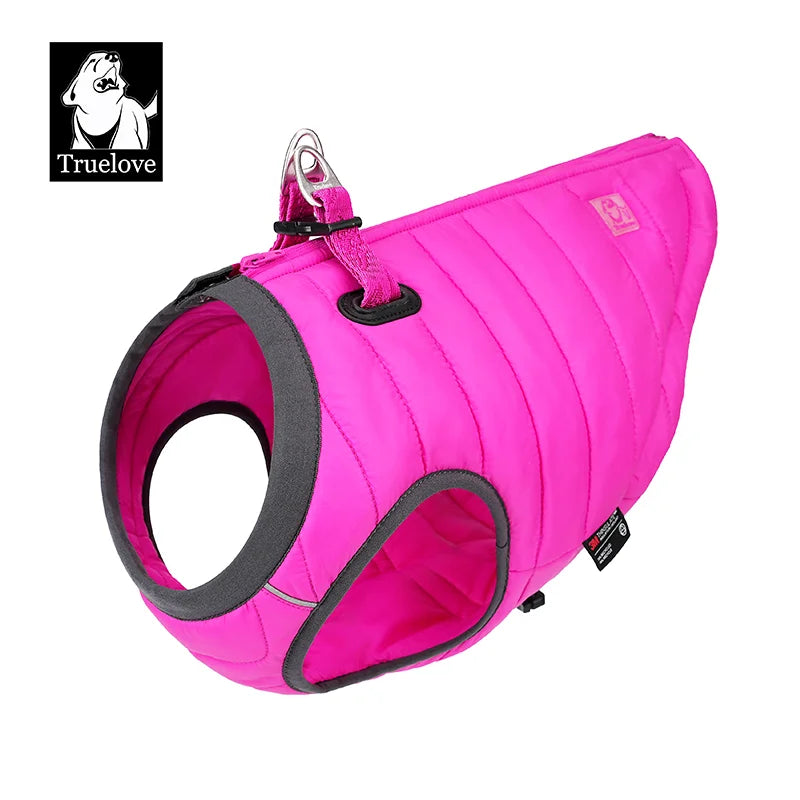 Pink quilted dog winter coat with harness loop and front opening
