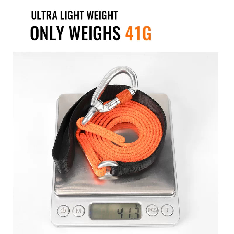 Orange reflective dog leash shown on a weight scale with black handle and clasp