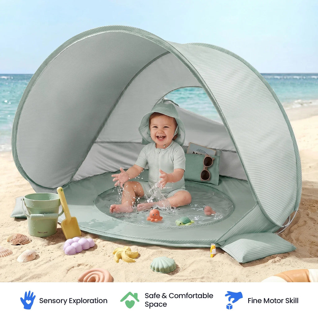 Green striped baby beach tent with circular door opening and transparent play tub