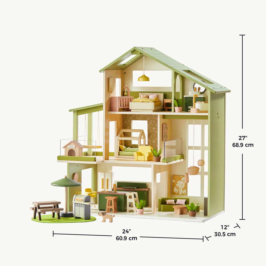Green Tiny Land dollhouse with cream walls, three levels, and an angled roof