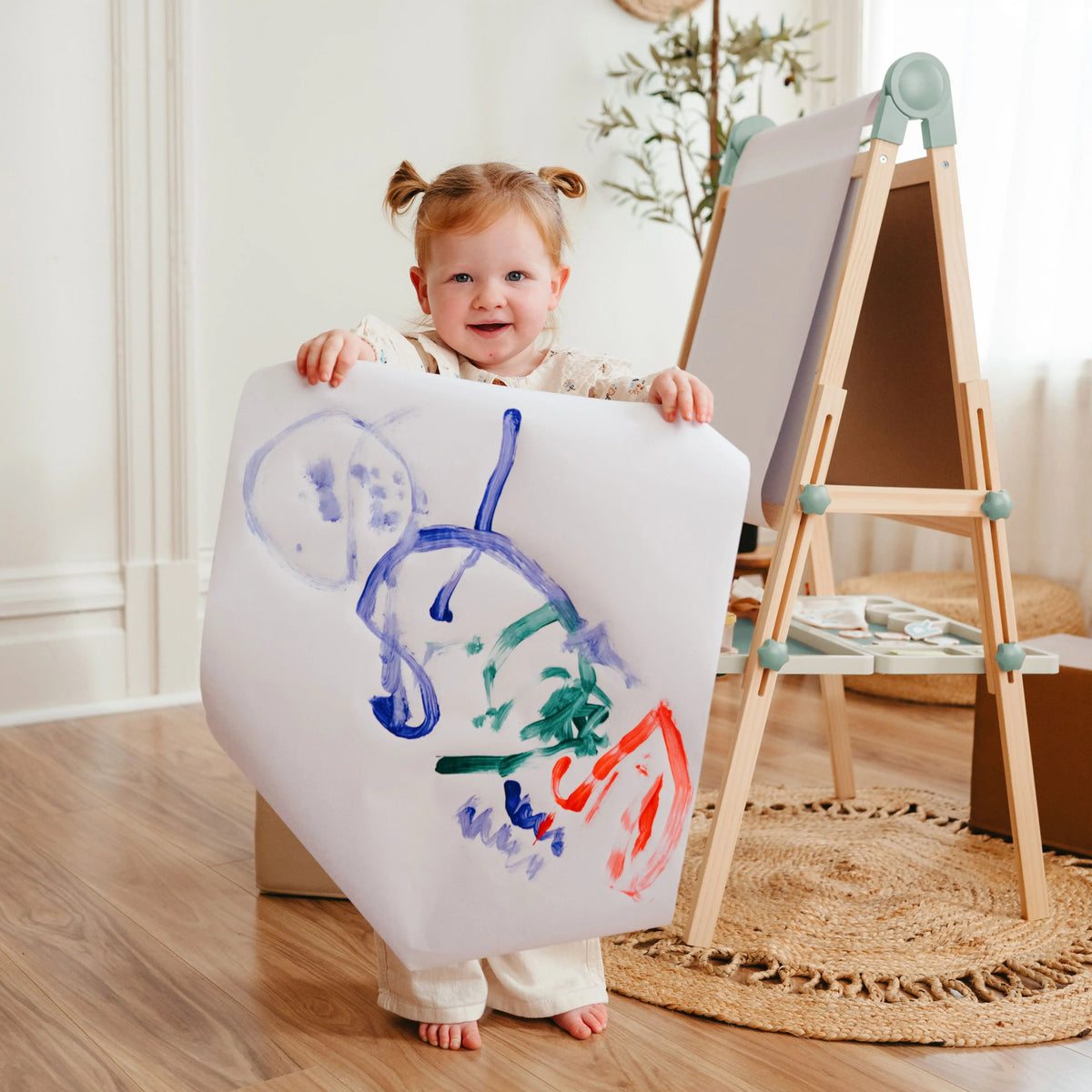 Tiny Land® easel with blank writing board and magnetic accessories on the tray