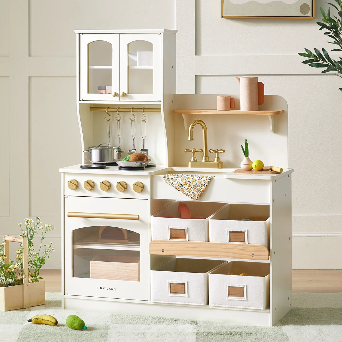 Wooden play kitchen with storage, cream cabinet with gold faucet and cookware set