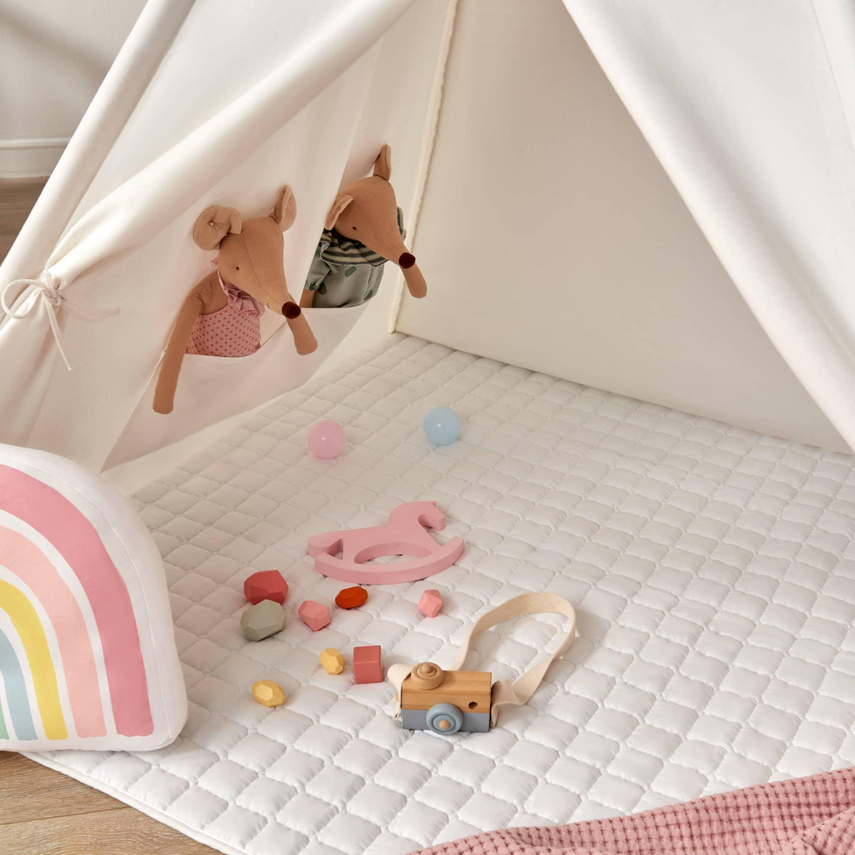 Kids teepee tent with quilted floor mat and toys, white canvas interior