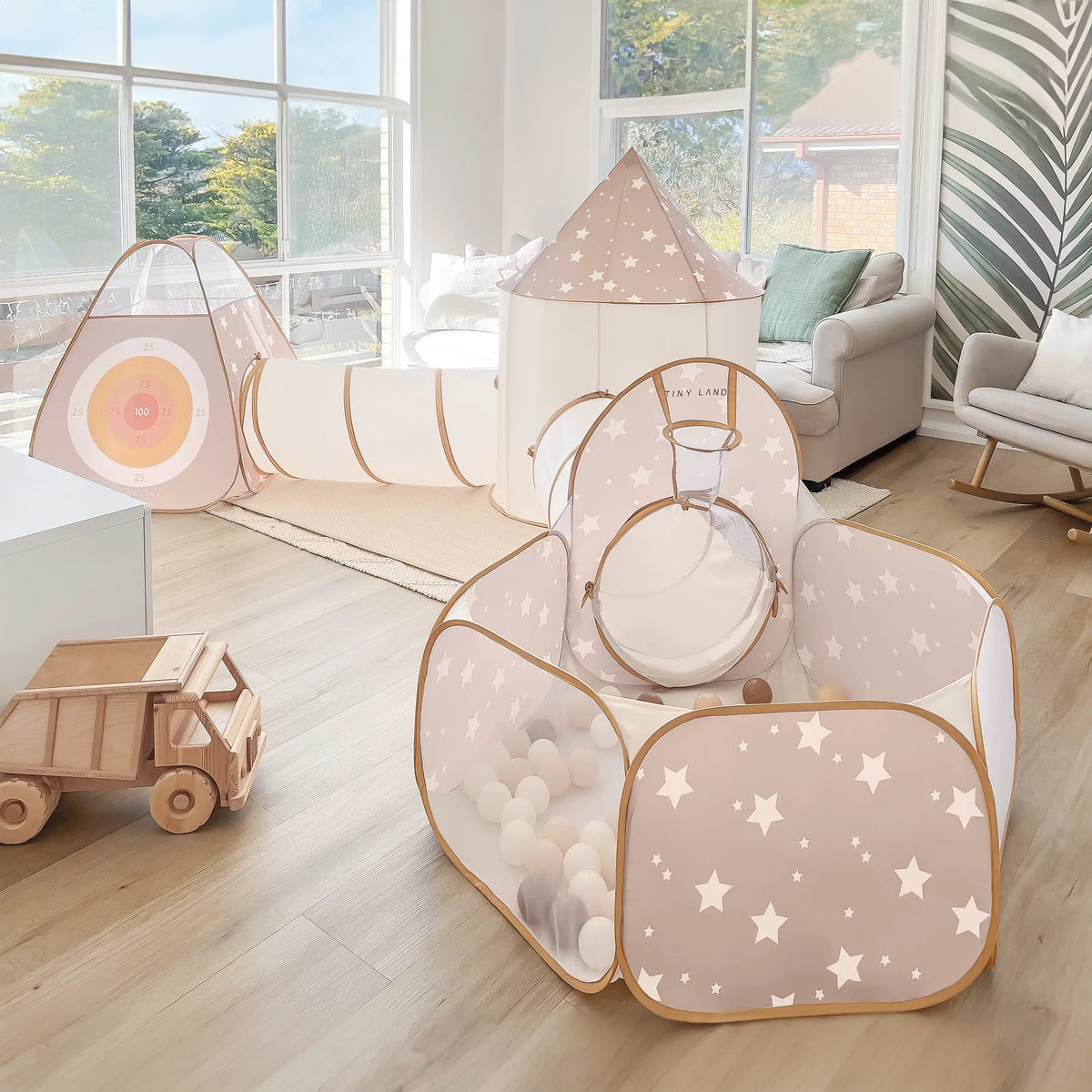 Indoor play tunnel with star-dome roof and open entrances, beige and white fabric frame