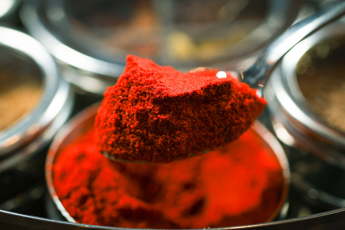 Spice wheel compartment with bright red spice pile and dark spice layer