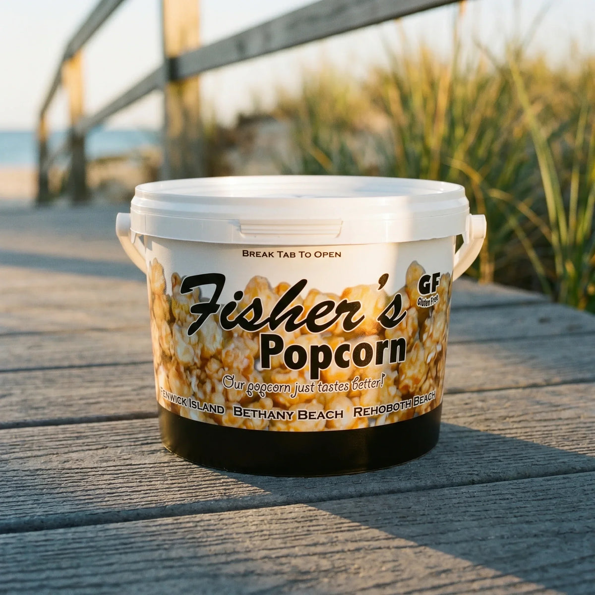 Fisher's popcorn tub with handle and lid, printed logo, on outdoor wooden deck