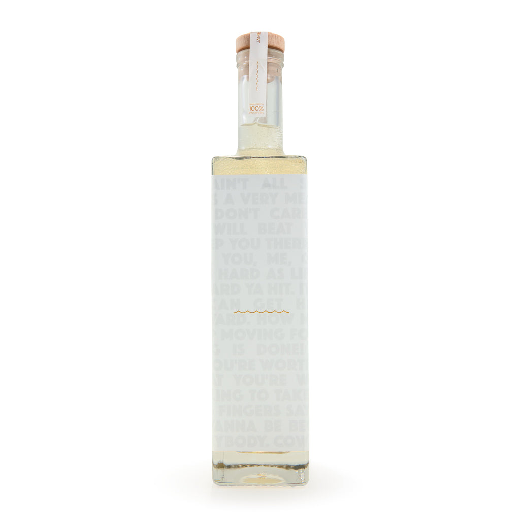 Tobacco & Vanilla bubble bath bottle back view with faint label text and barcode area.