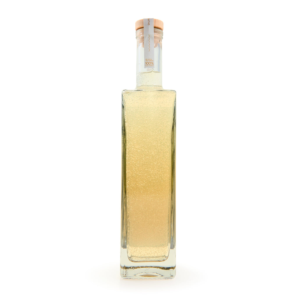 Tobacco & Vanilla bubble bath bottle with clear glass showing amber liquid inside.