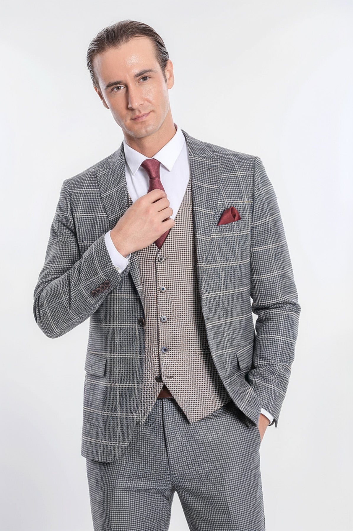 Slim-fit checked grey suit with waistcoat, maroon tie, and red pocket square