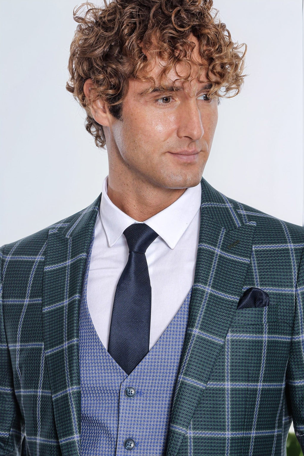 Slim fit green men suit with plaid jacket, blue vest, and black tie