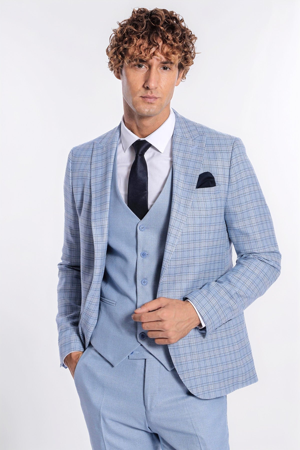 Light blue checked slim-fit suit with tie, vest, and pocket square.