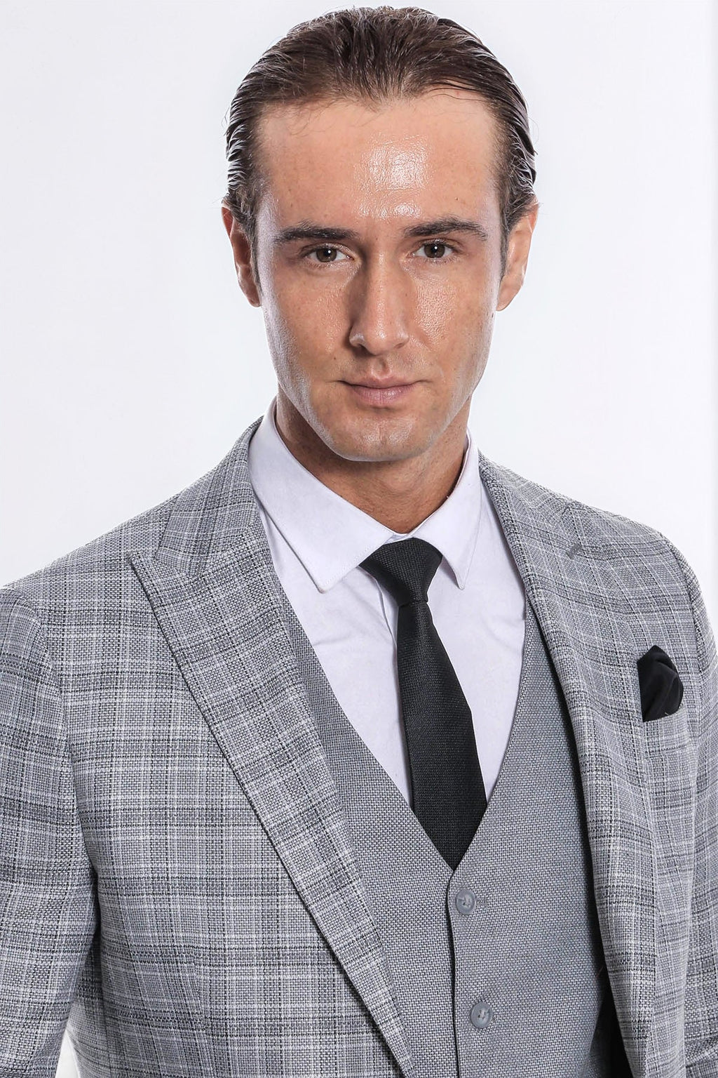 Wessi men's light grey checked suit close-up: lapel jacket, black tie, pocket square