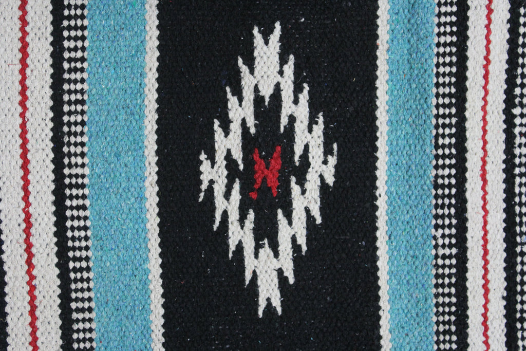 Western saddle blanket in black with turquoise side stripes and white/red diamond motif
