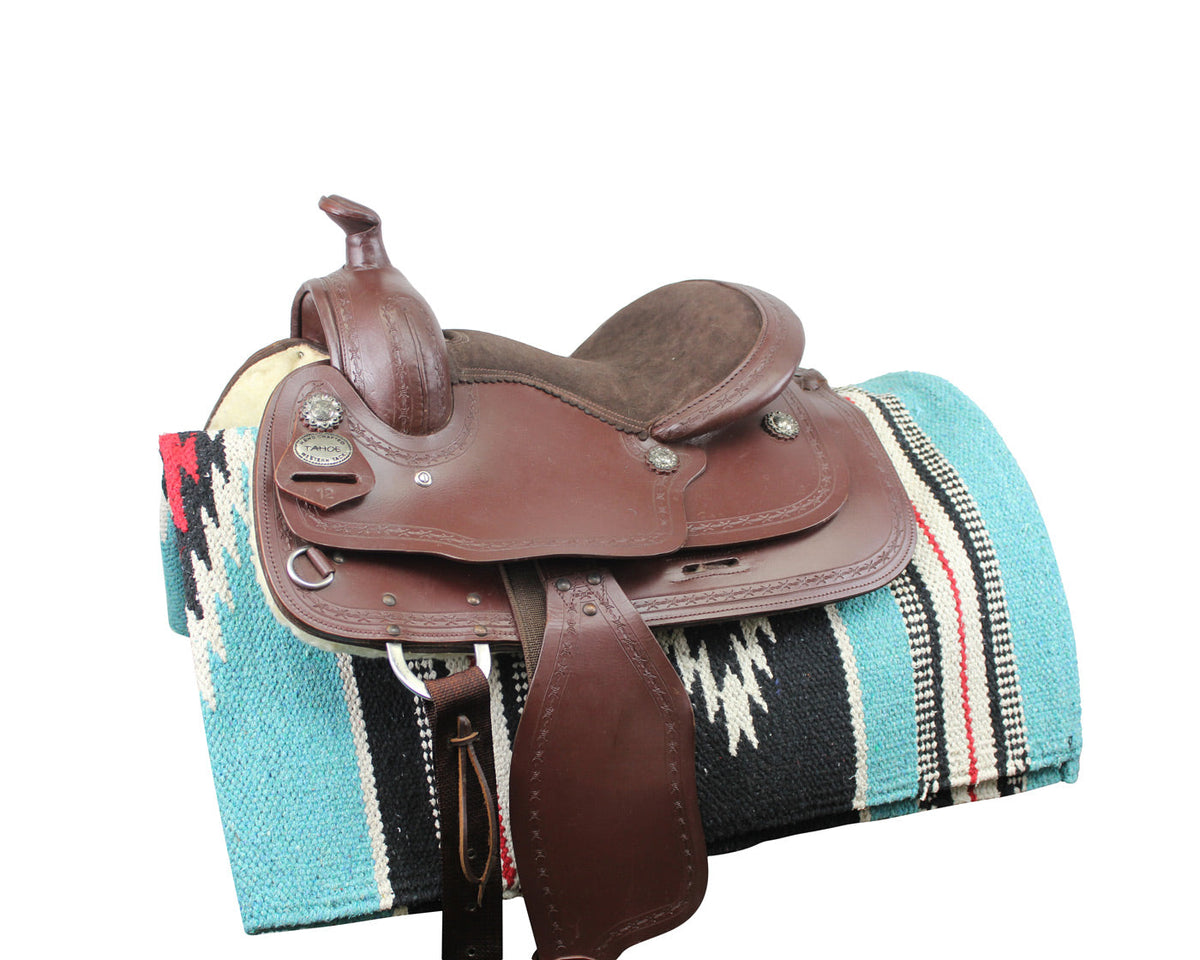 Western saddle blanket draped on a saddle, turquoise and black with white striped pattern