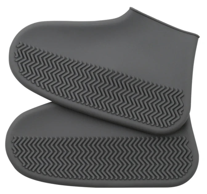 Gray silicone shoe cover boots with chevron grip sole pattern, pair