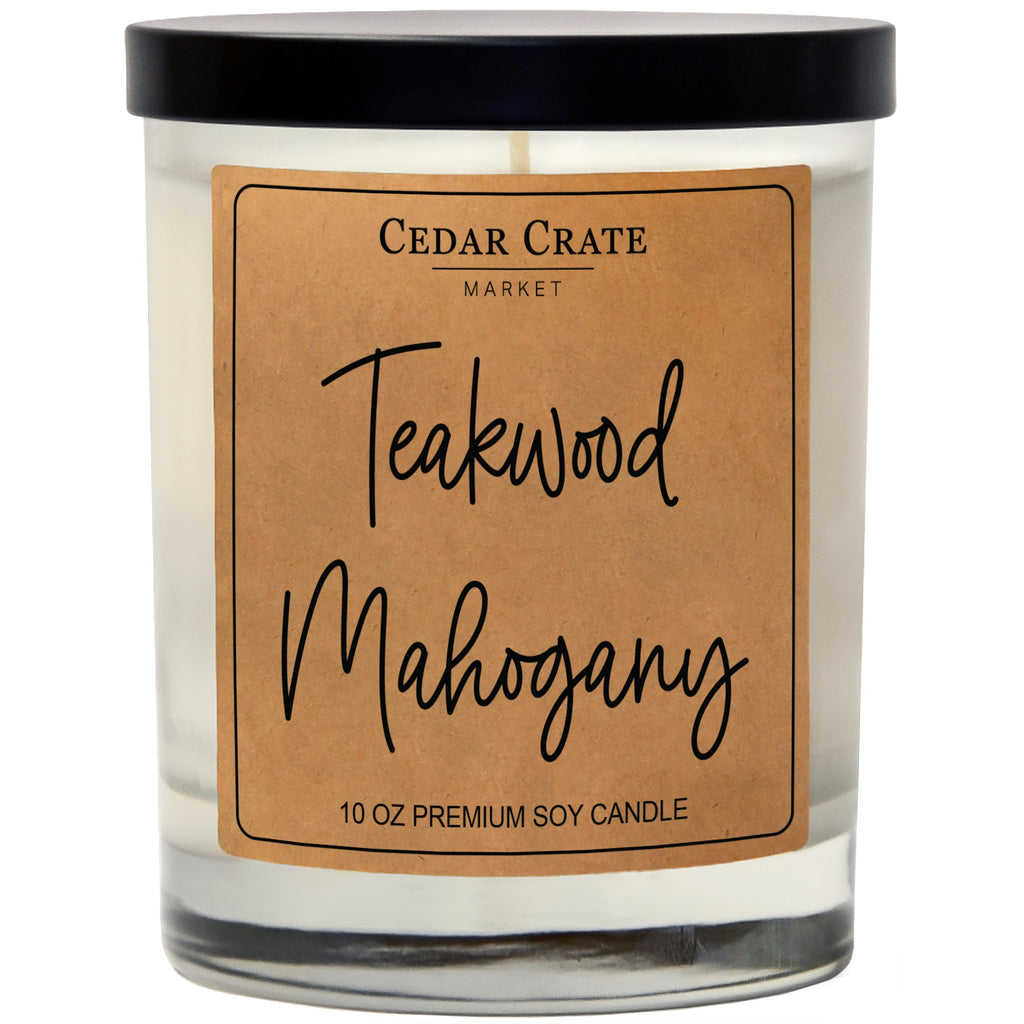 Teakwood Mahogany soy candle in clear glass jar with black lid and kraft label