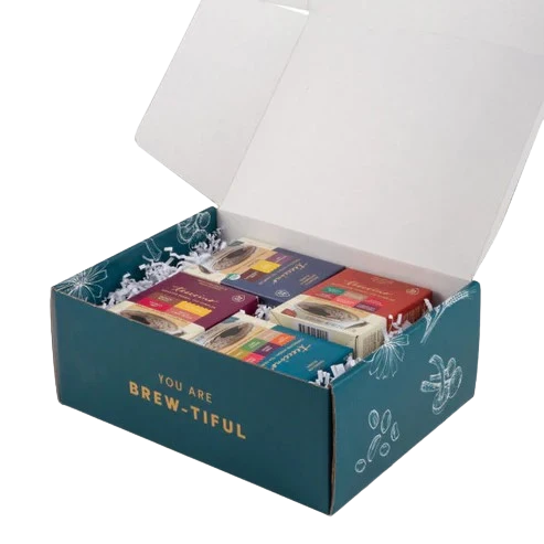 Herbal tea sampler gift box open, showing assorted tea packets inside