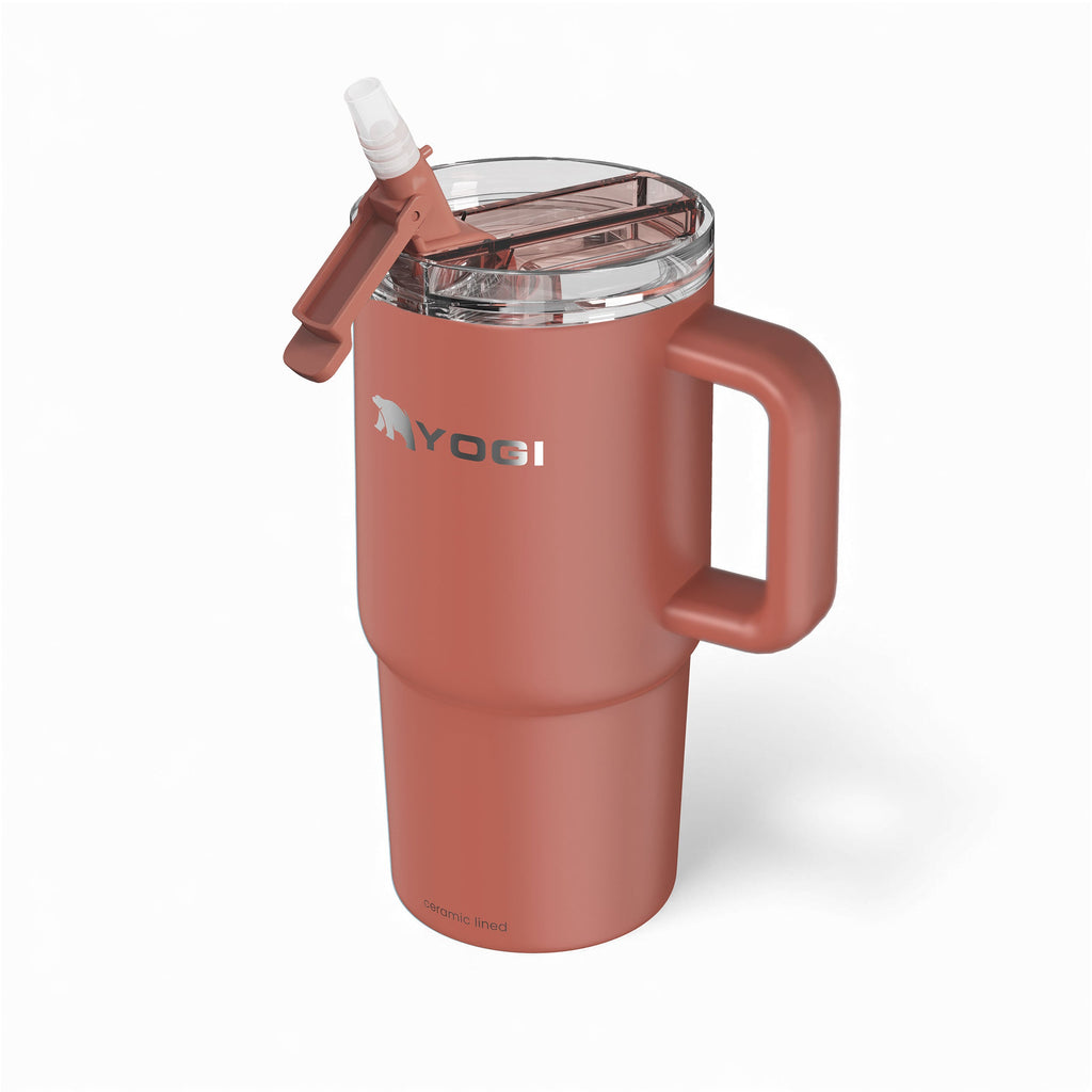Ceramic-lined tumbler in terracotta with flip-open clear lid and sip straw
