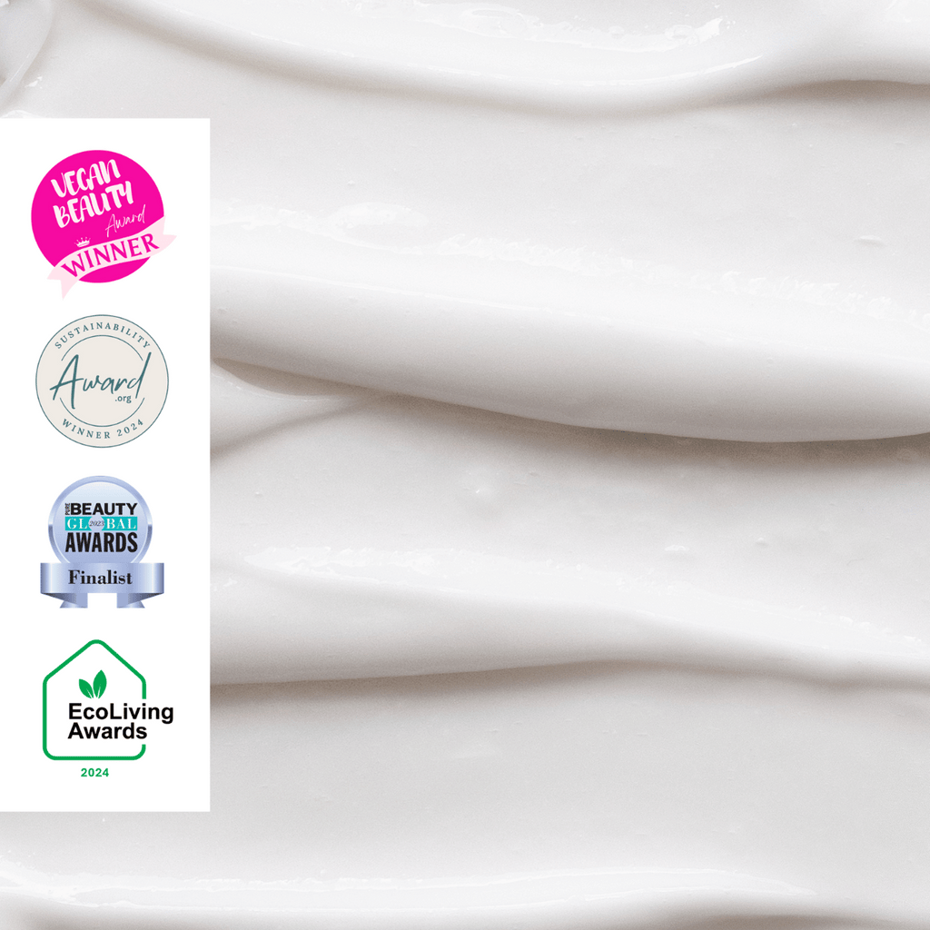 Thick white cleansing face milk texture swirled in a smooth layer