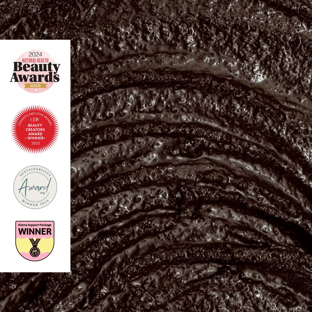 Close-up of dark exfoliating face scrub texture