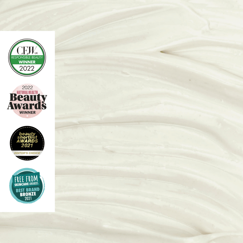 Swirled face moisturizer cream with award badges on the left