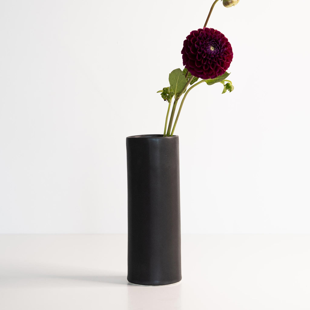 Handmade porcelain flower vase, mica black, tall cylinder with purple pom-pom flowers