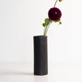 Handmade porcelain flower vase, mica black, tall cylinder with purple pom-pom flowers