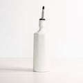 Porcelain olive oil dispenser in silk white with black pour spout and pump