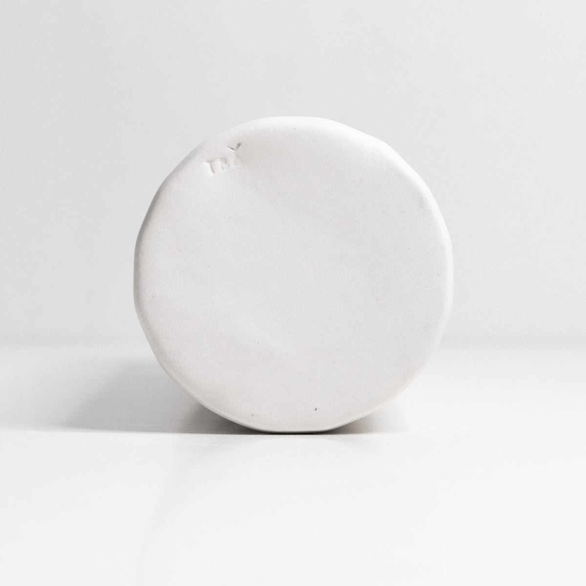 Elixir porcelain olive oil dispenser, round white ceramic body with pour spout