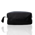 Black leather toiletry bag with top zipper and wrist strap.
