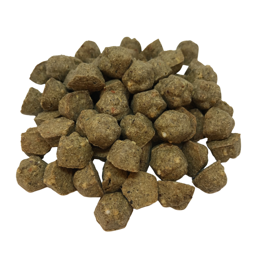 Brown lamb oven-baked kibble pieces with a chunky, irregular shape