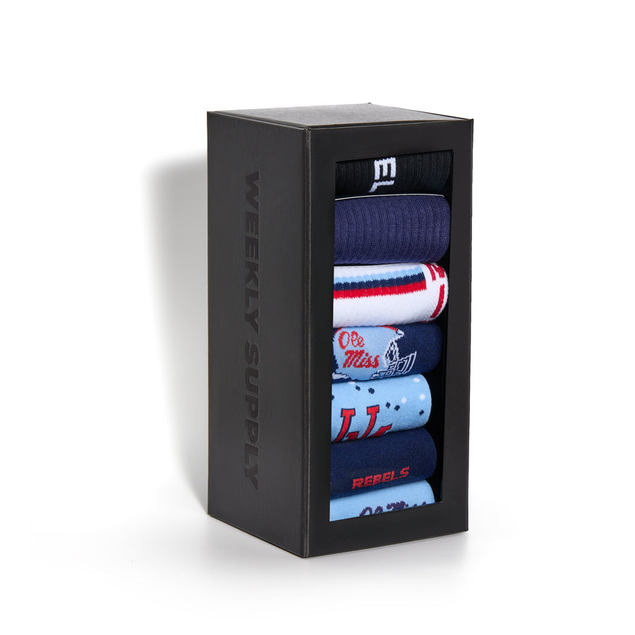 Assorted crew socks gift box with folded socks in navy, light blue, and white