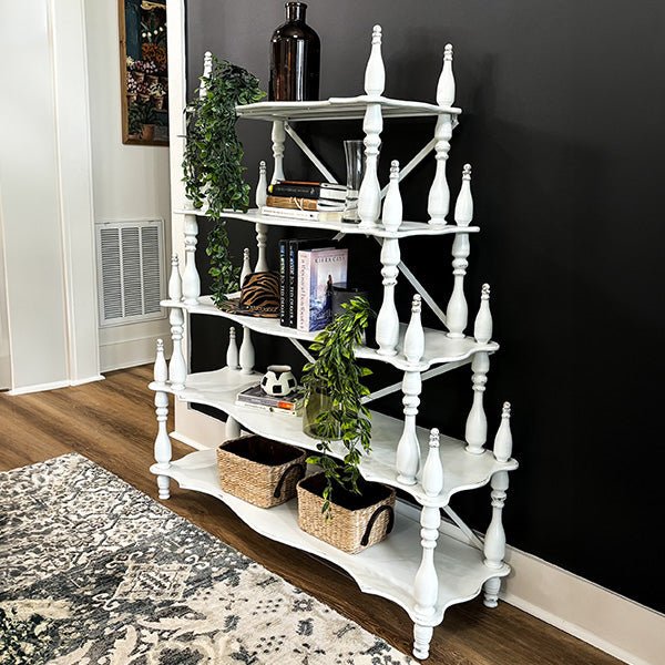 Distressed white corner etagere shelf with turned posts and multiple open shelves