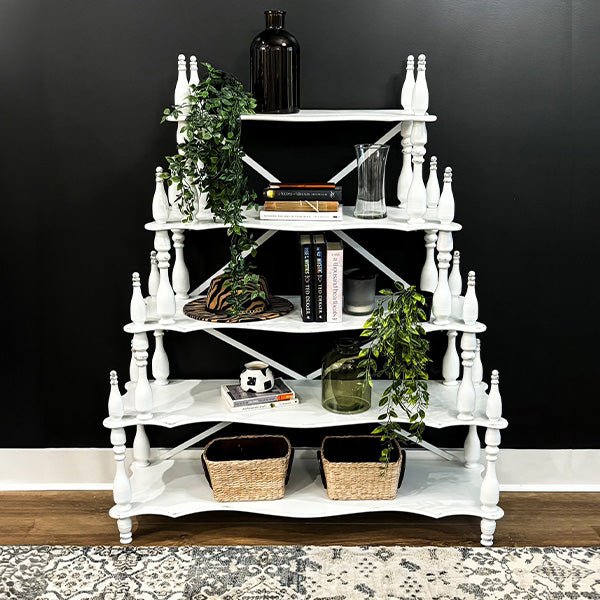 Distressed white etagere shelf unit with turned columns, X braces, and five tiers