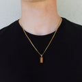 Gold-tone tiger eye pendant necklace with rectangular stone and short bail