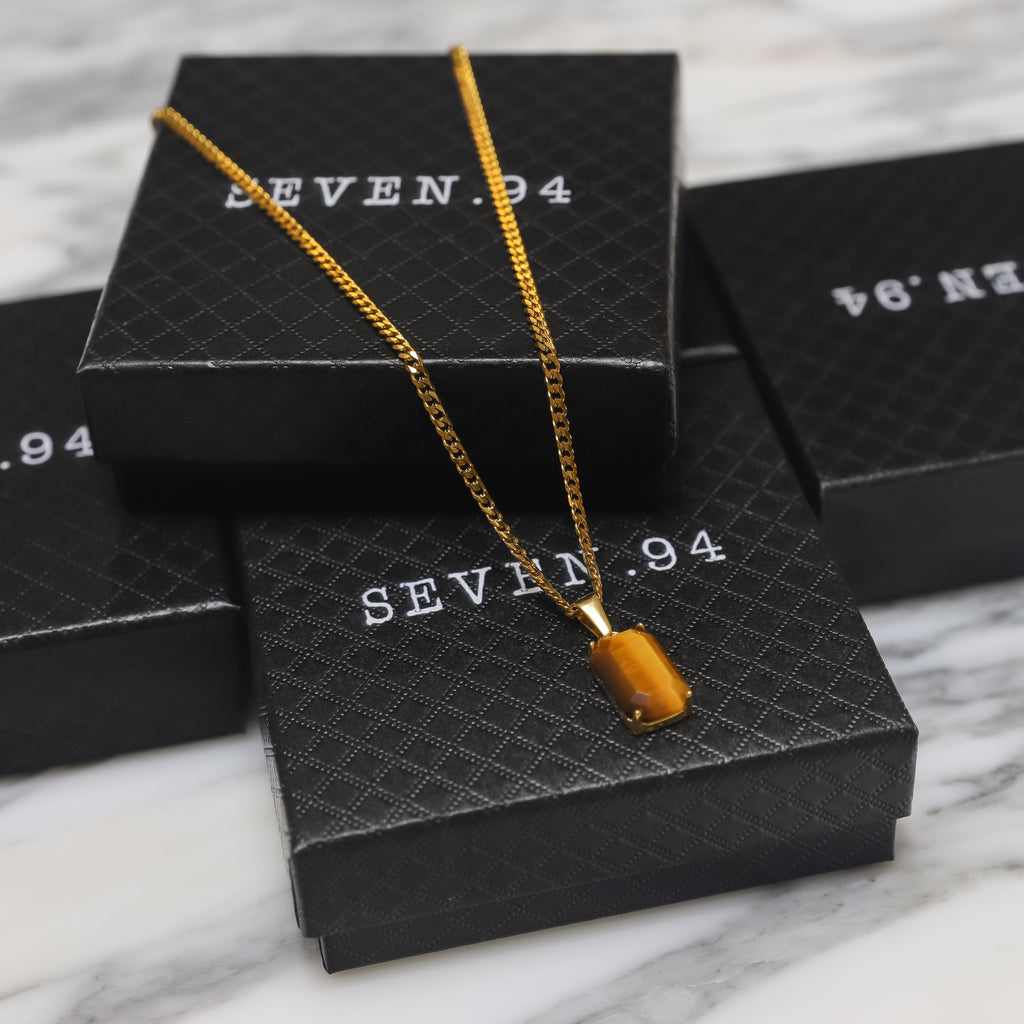 Tiger eye stone pendant on gold-tone chain, rectangular stone detail