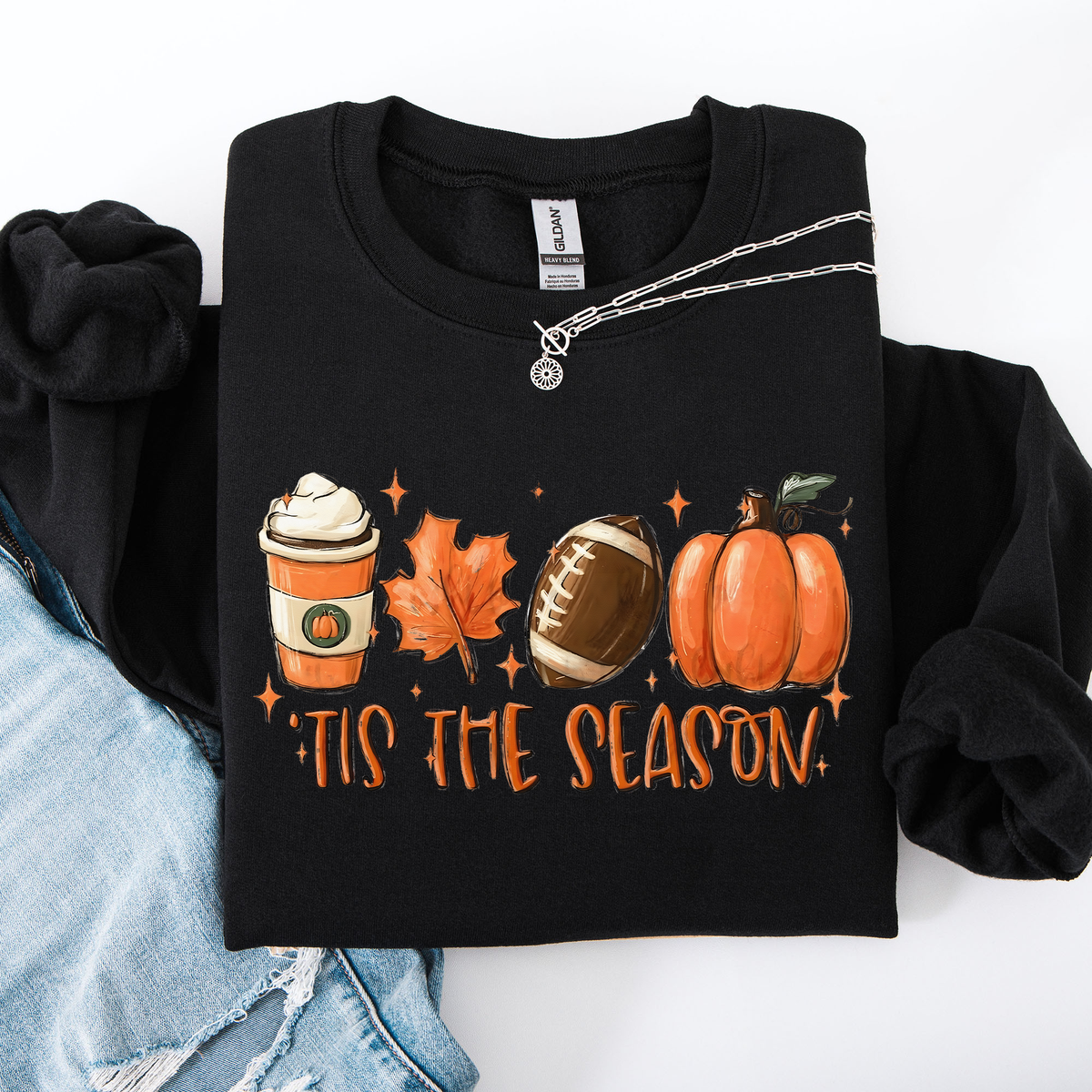 Black crewneck sweatshirt with “Tis the Season” football, pumpkins, and coffee graphic.