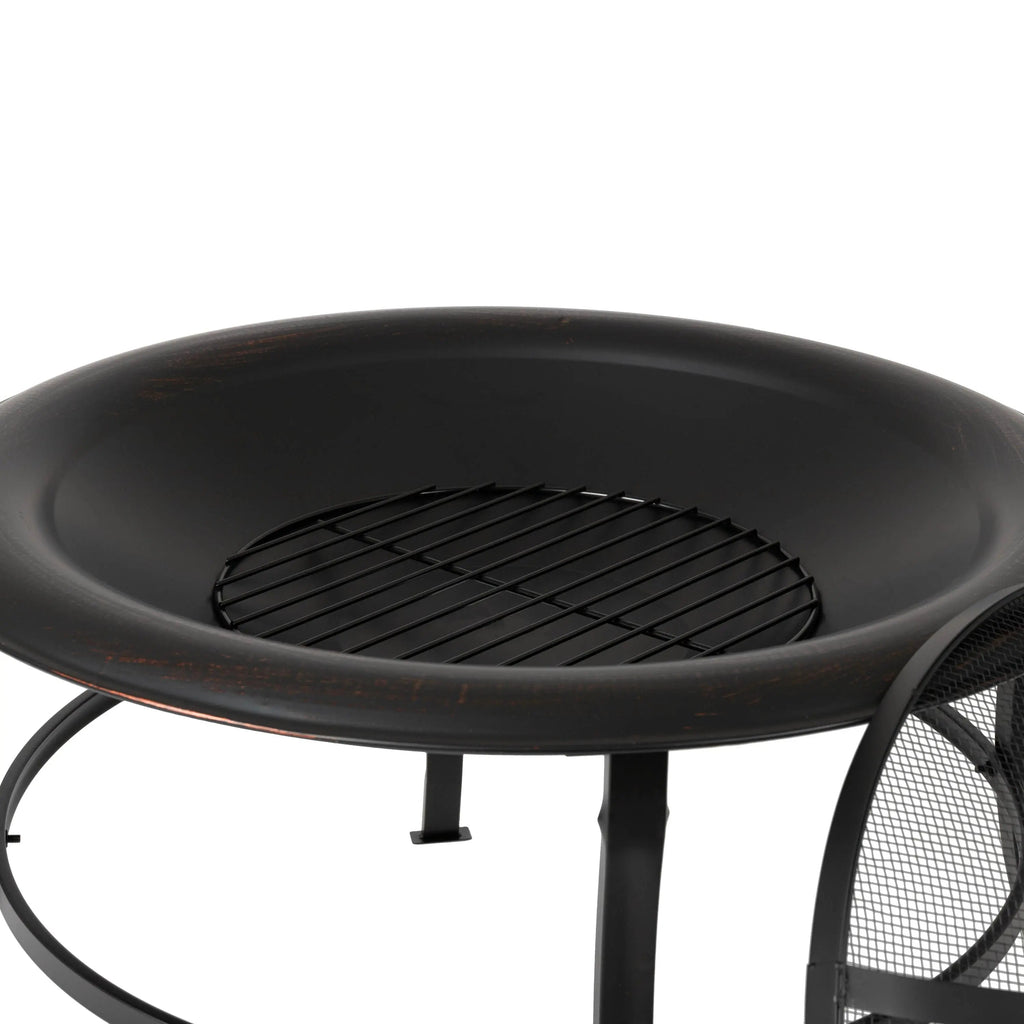 Close-up of round fire pit interior with grate over dark bowl