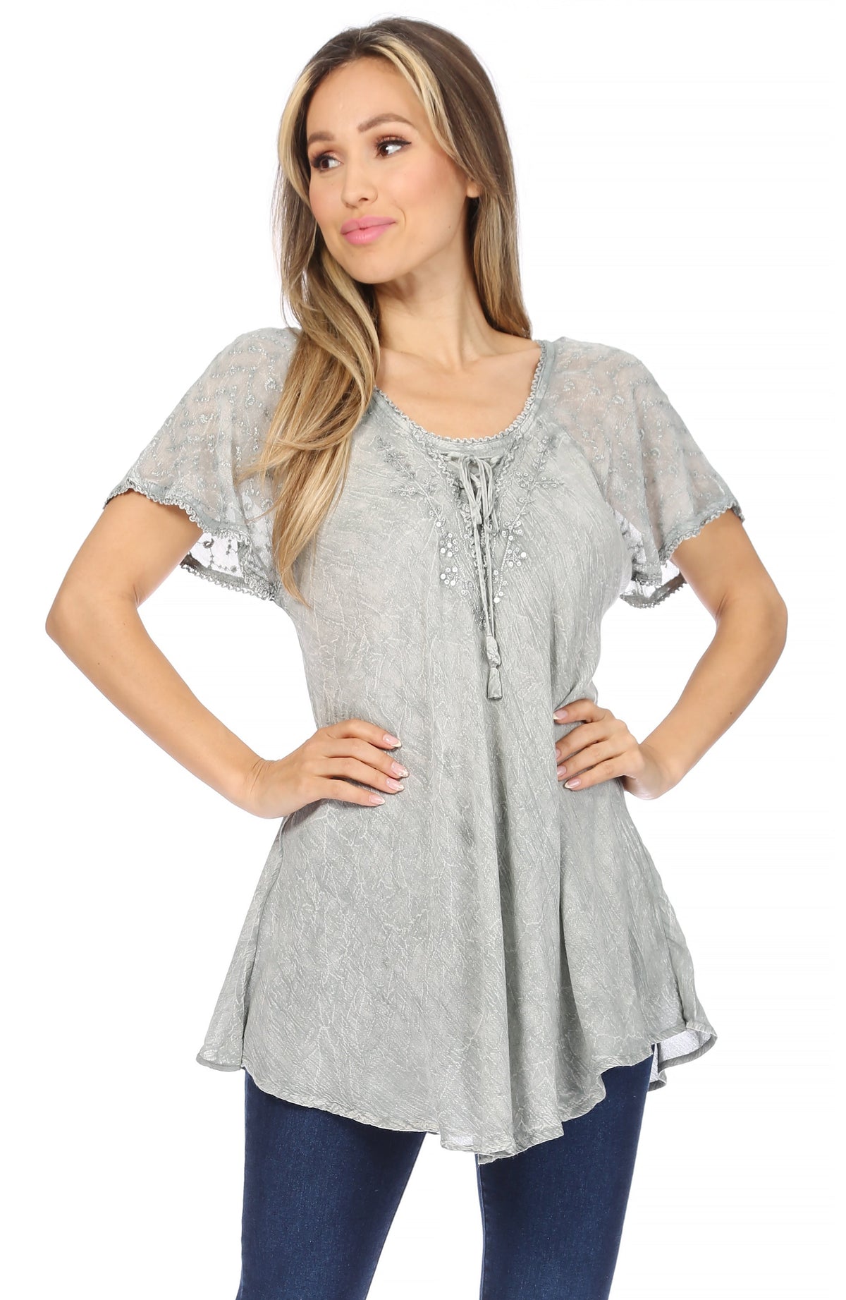 Light gray sequin-embroidered tunic blouse with cap sleeves and scoop neckline.