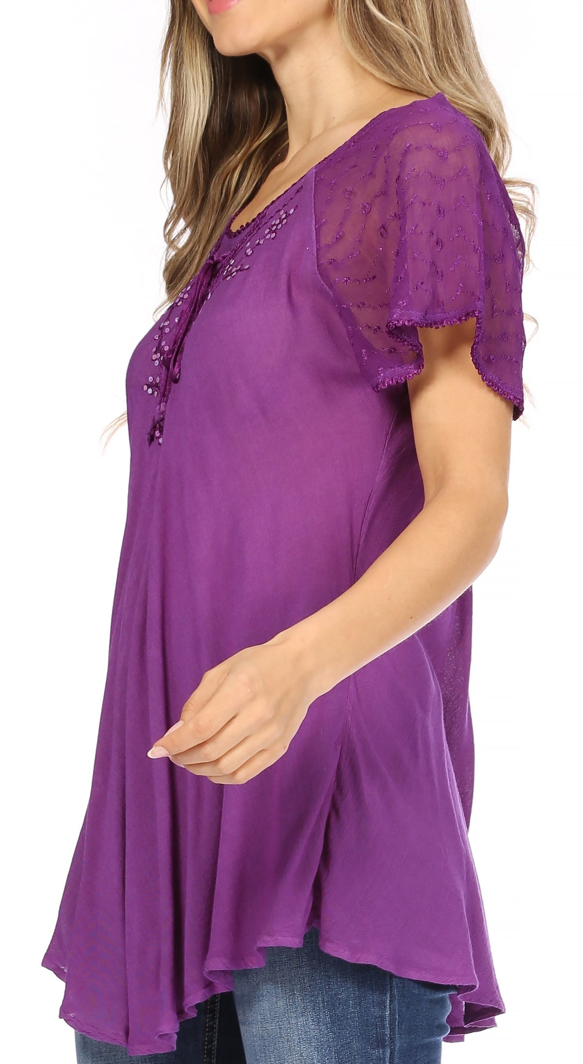 Purple tunic blouse with sequin embroidery at neckline and lace-trim cap sleeves, side view