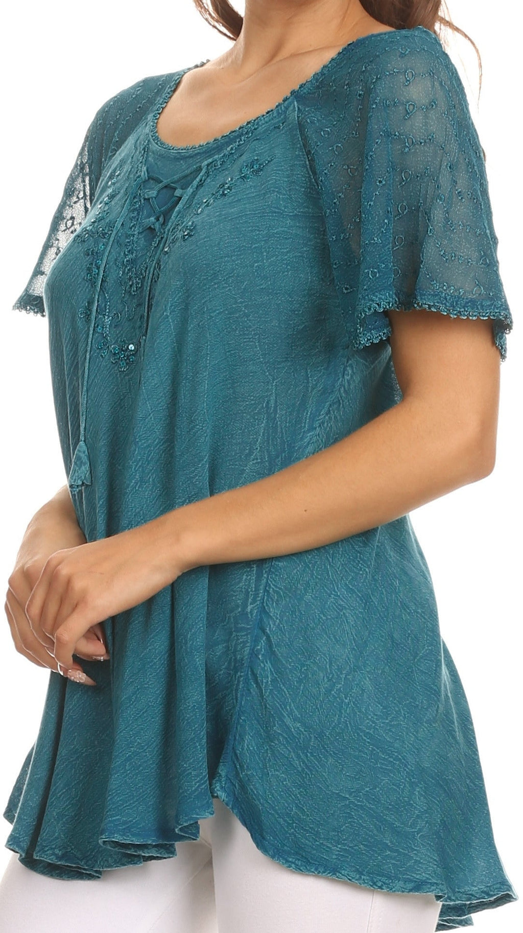 Teal embroidered blouse with sequin accents, short sleeves, and relaxed tunic length