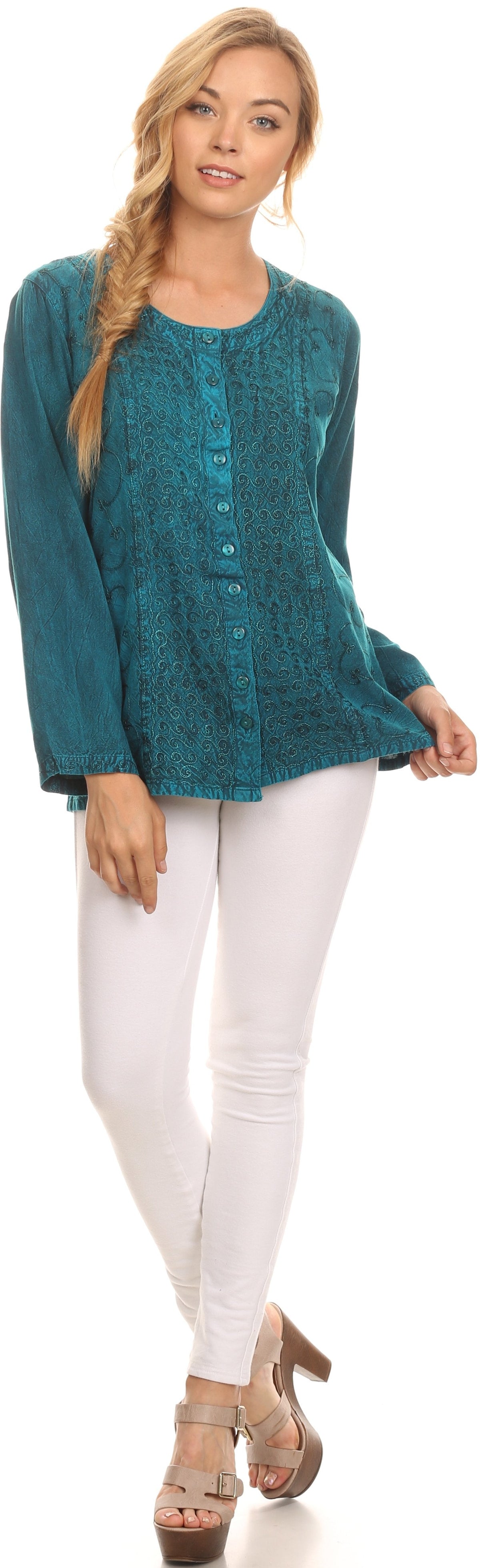 Teal long-sleeve blouse with deep scoop neck and button front worn with white pants