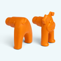 Tangerine orange animal-shaped bottle stopper with cat face, shown from side angle