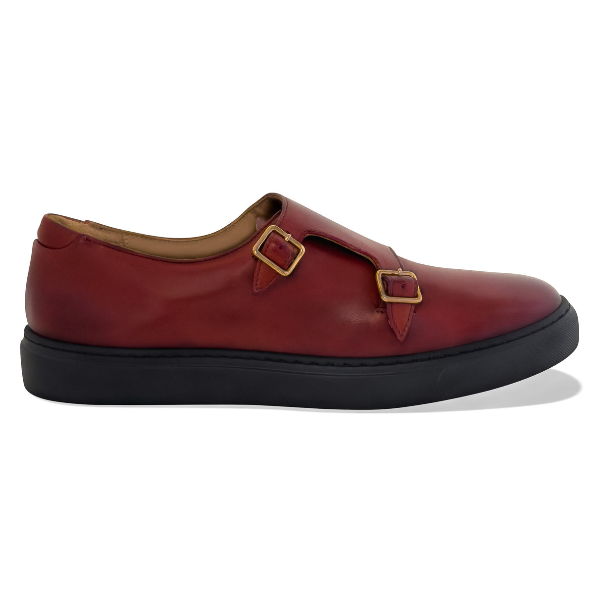 Women’s slip-on shoes in dark red with side straps and gold-tone buckles, black sole