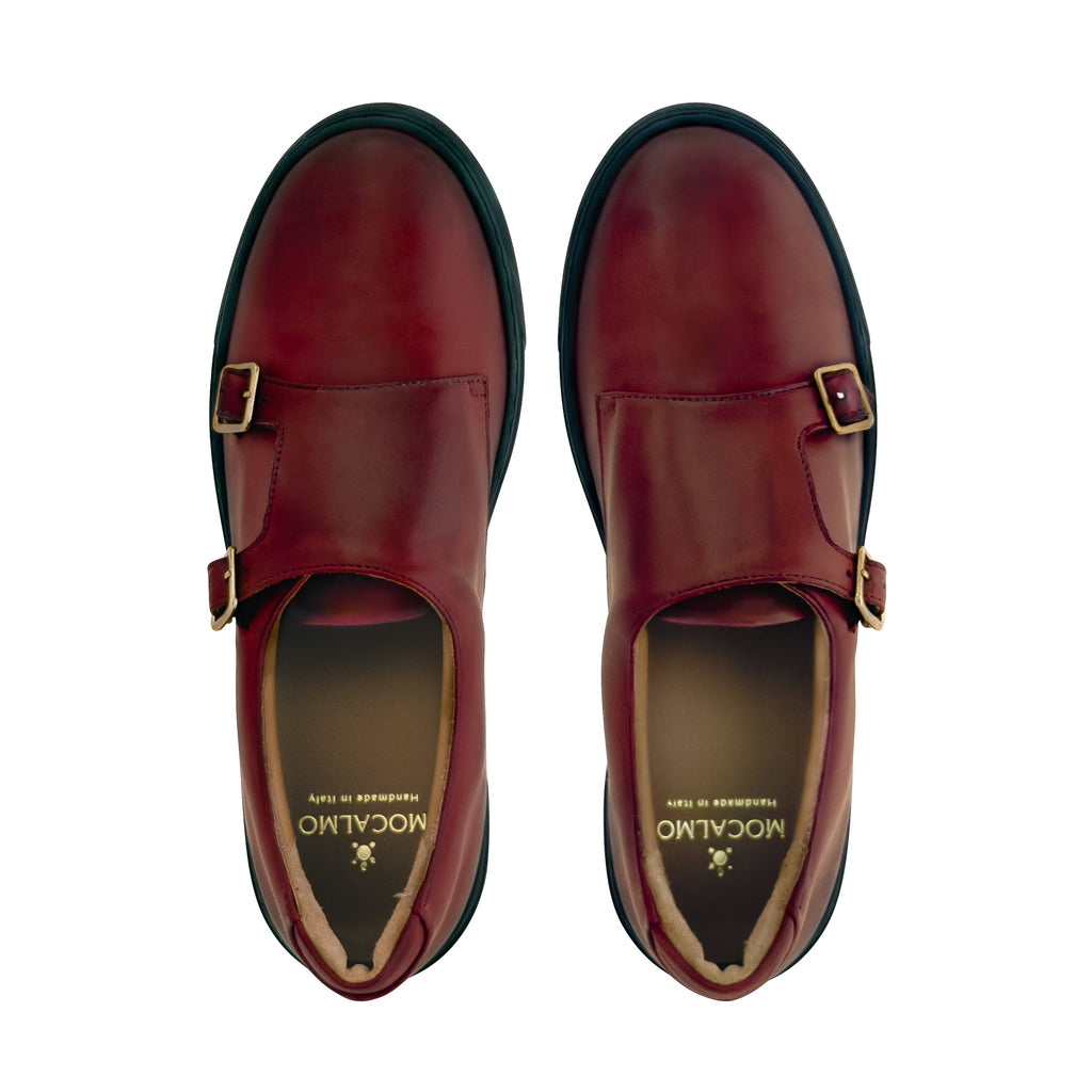 Women’s dark red slip-on shoes, open toe view shows cushioned lining and gold buckles