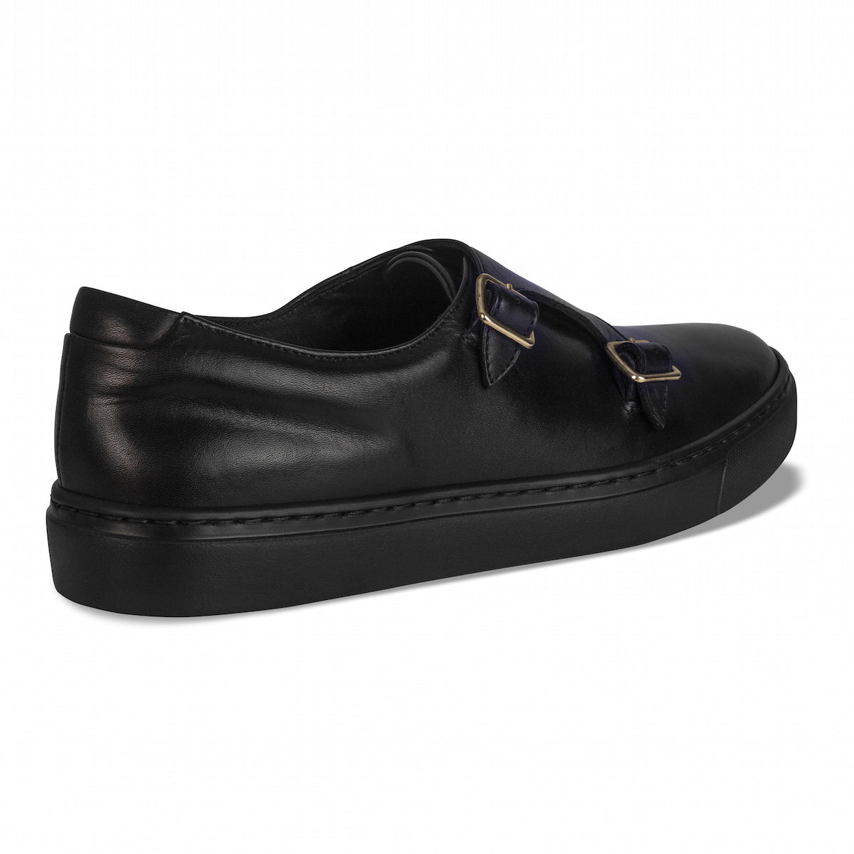 Black slip-on loafers with two gold-tone buckles and stitched trim