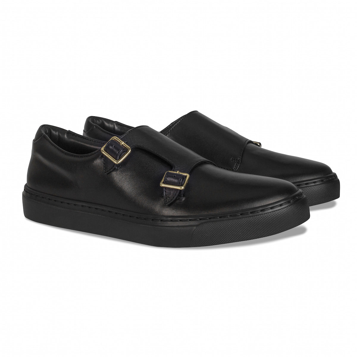 Black slip-on loafers with double buckles and thick rubber sole