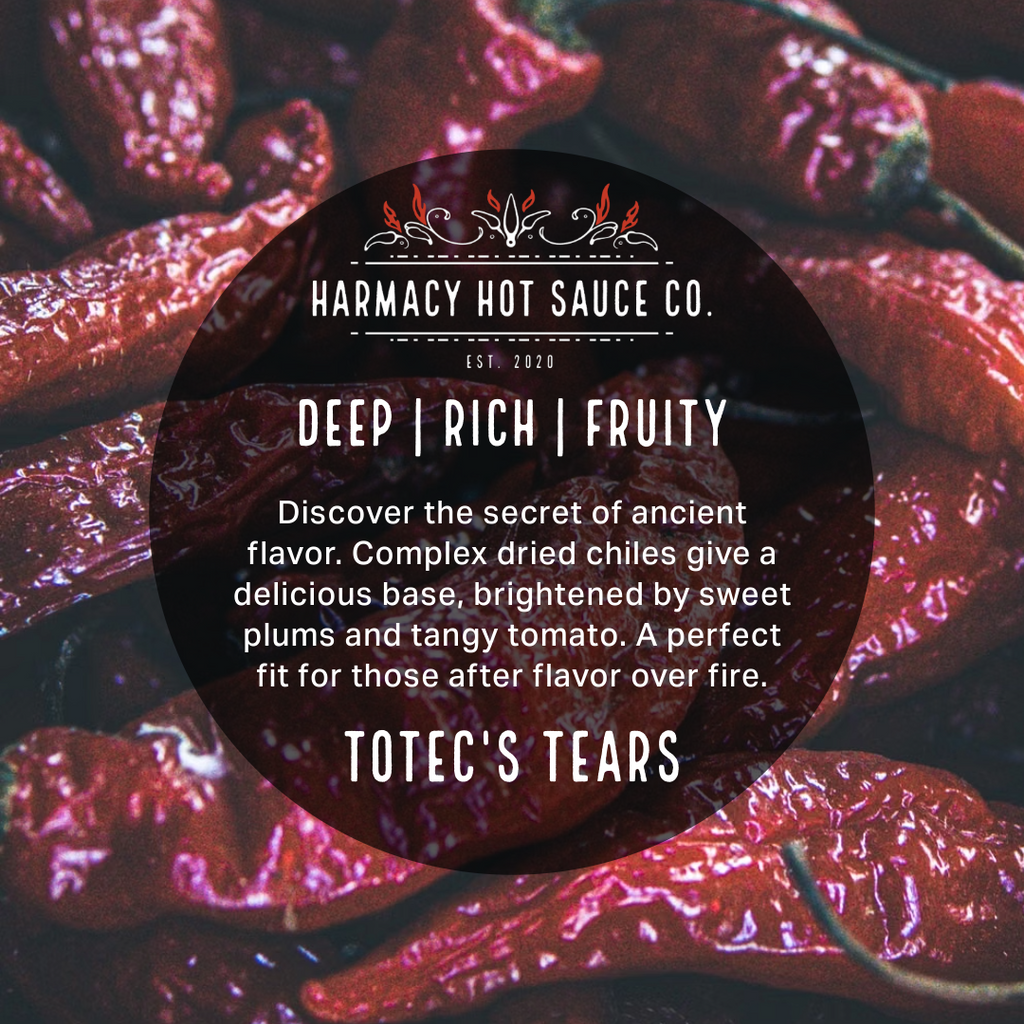 ToTec's Tears hot sauce label on grilled purple peppers