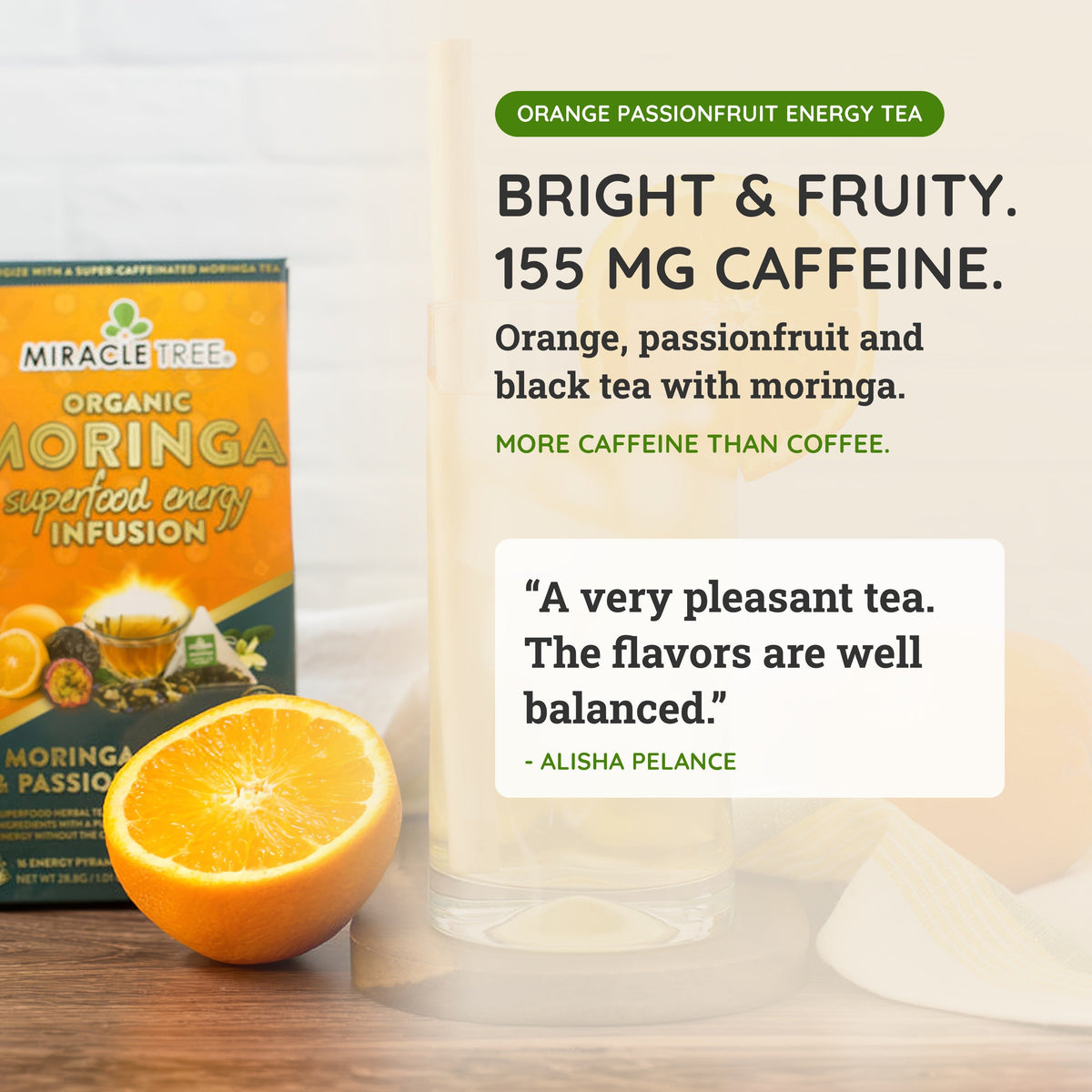 Moringa orange passionfruit energy tea box with cup of tea and orange slice