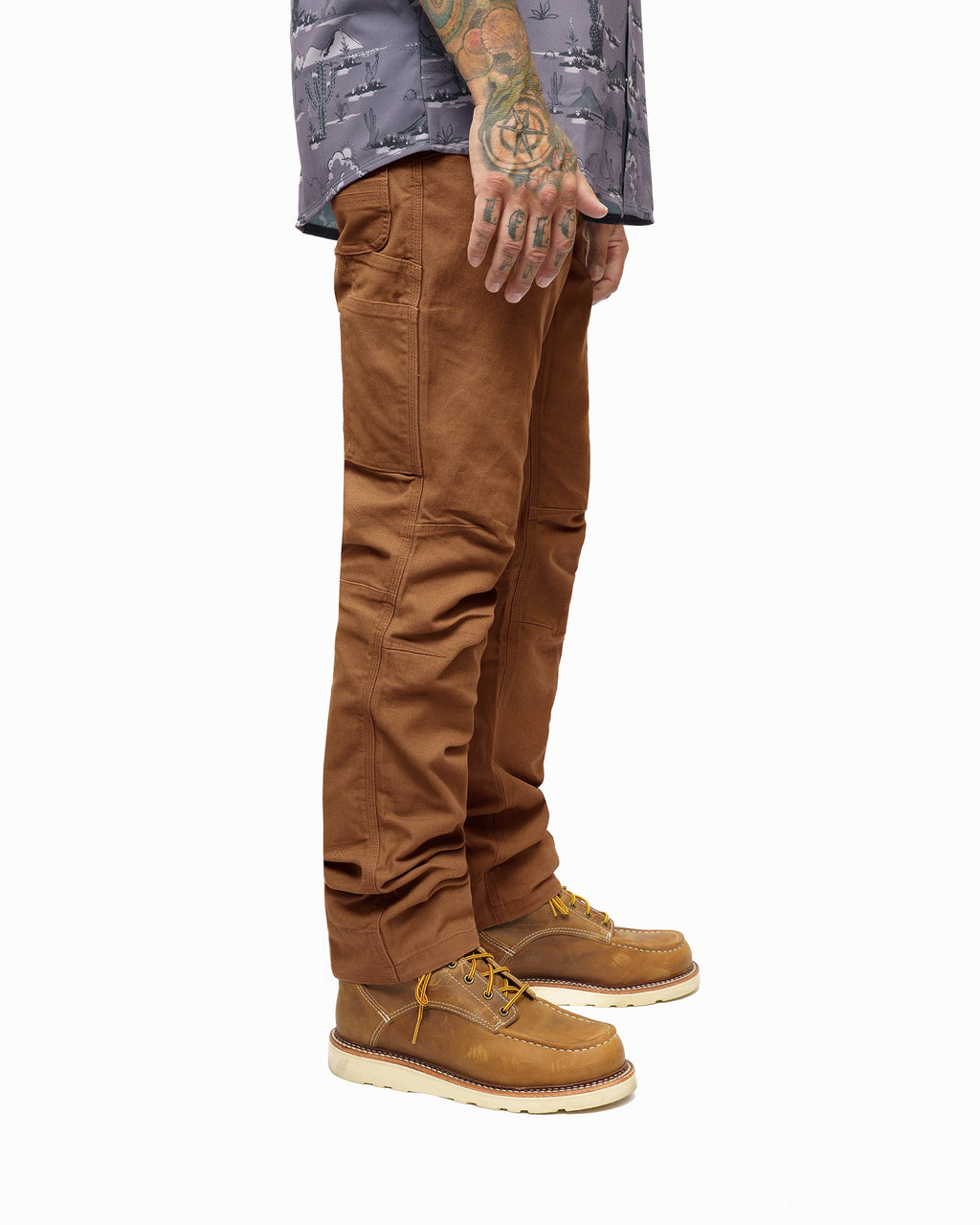 Standard-fit pants in TOB with cuffed hem, paneling on knees, and boot-ready fit